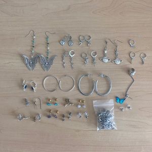 assortment of earrings and earring cuffs